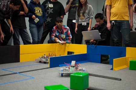 High school students compete in the annual Pioneers in Engineering robotics competition.