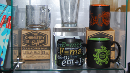 various mugs with science themed logos