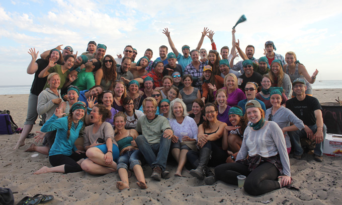 Beetles: Outdoor Educators group celebrating on a beach