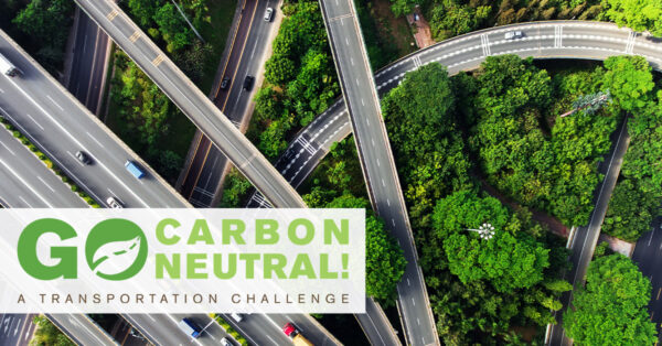 Go Carbon Neutral! A Transportation Challenge. A photo of multiple highways criss-crossing a green forest.