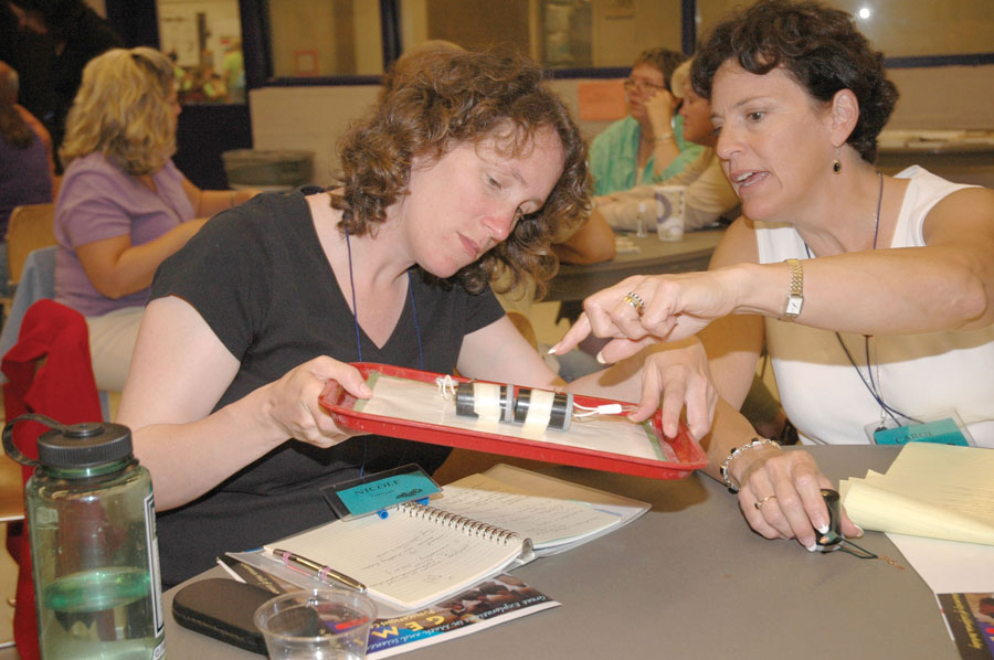 Two teachers work together during professional development