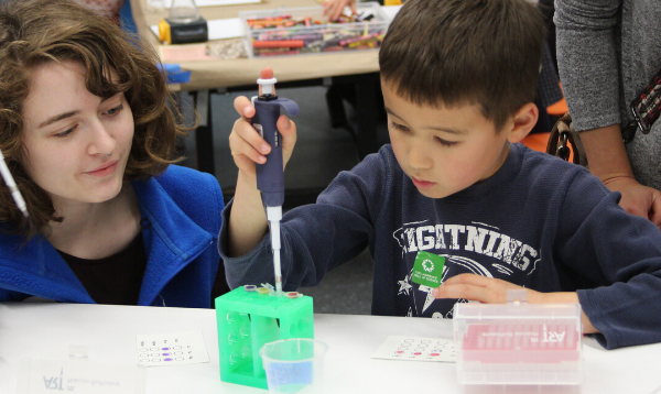 Two children conducting a science experiment in the Biotech lab