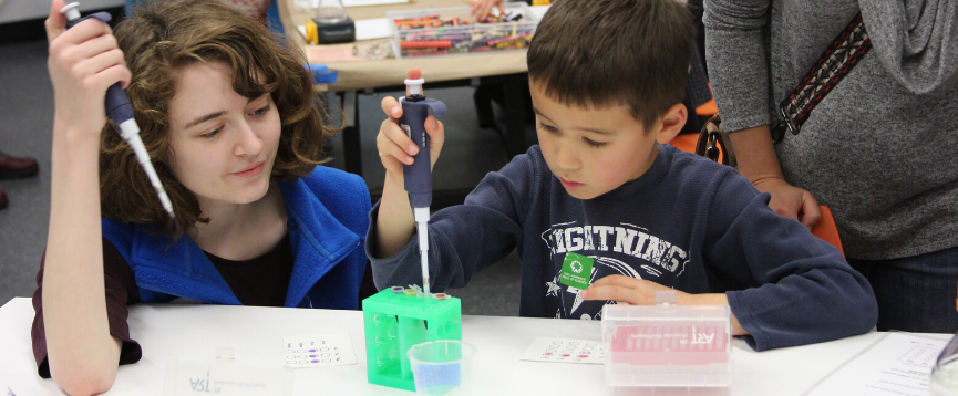 Two children conducting a science experiment in the Biotech lab