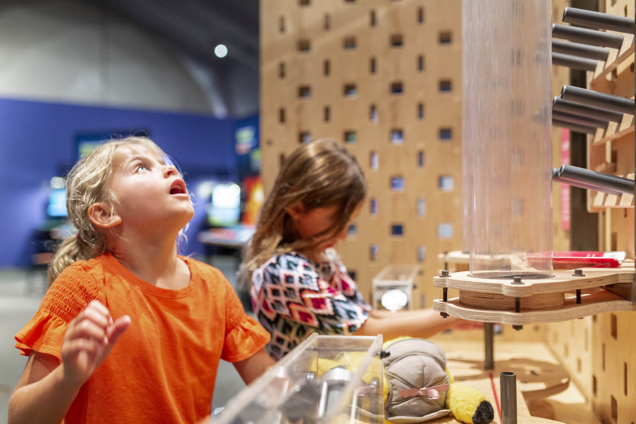Two children exploring a science exhibit