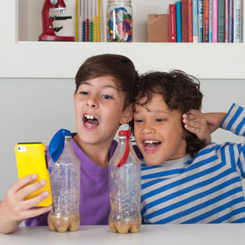 Two children looking at a science app