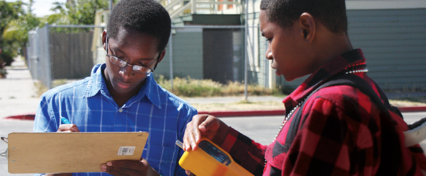 Two high school students record environmental data collected in EBAYS program