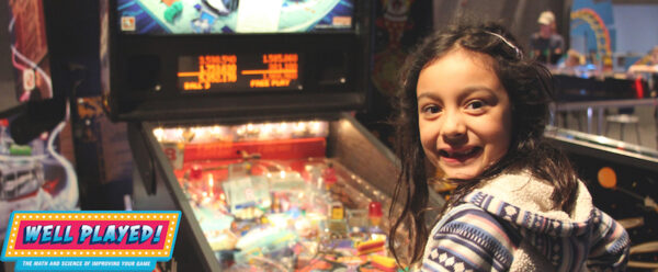 Girl at pinball machine