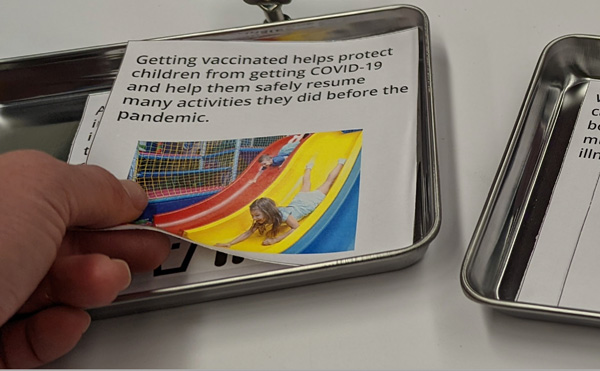 The Vaccine and You activity cards on trays