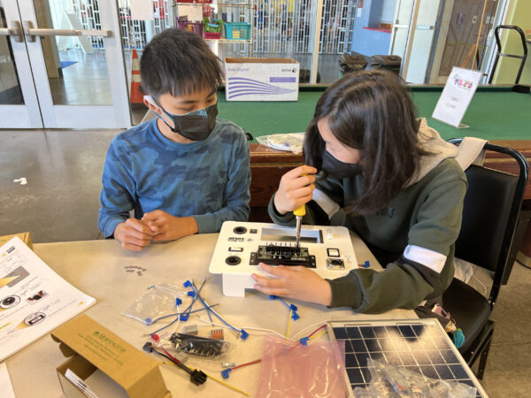 Two students are working on a solar science project at Solar Camp