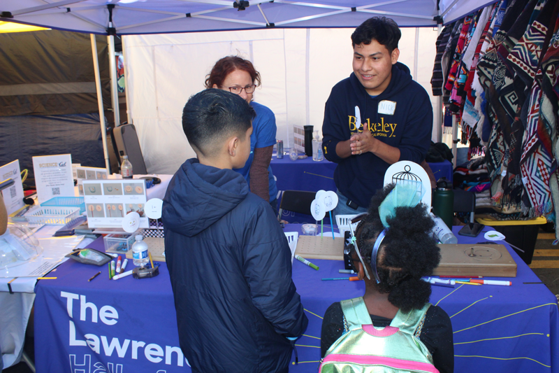A Lawrence On-The-Go staff is working with youth in the community