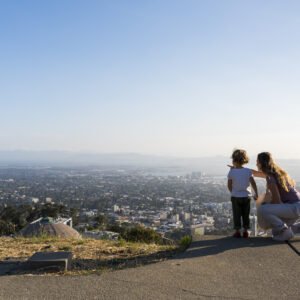 A Mother and child look out over The Lawrence's panoramic view of the San Francisco Bay.