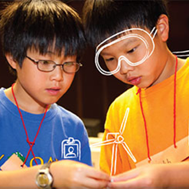 Two students are participating in a science activity