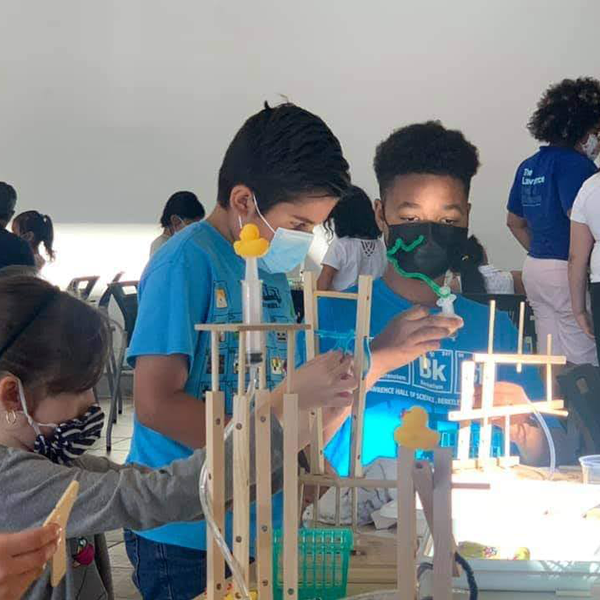 Students participate in the Engineering with Hydraulics workshop and build a hydraulic contraption