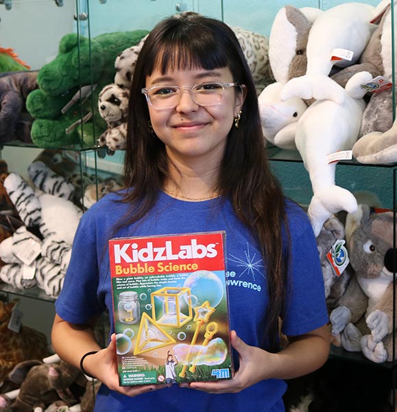 Discovery Store Office Lead Tigerlily Biskup holds up the Kidzlabs Bubble Science Kit as her staff pick of favorite store items.