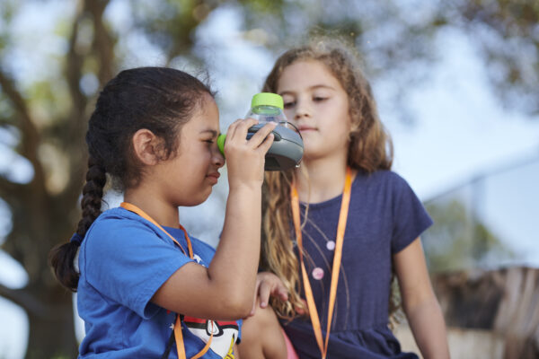 Two students investigate nature in the Outdoor Nature Lab