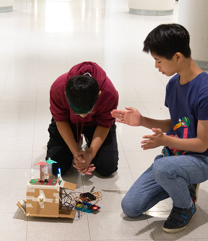Teens Testing the Nano Satellite in Coding Session.