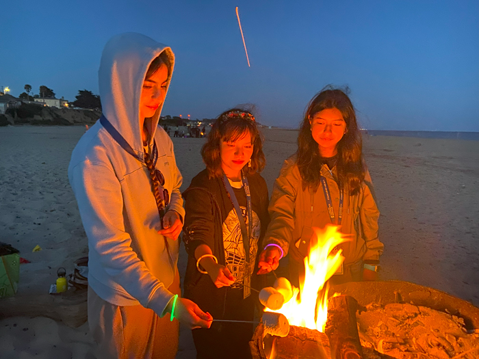 Marine Bio bonfire teens roasting marshmallows