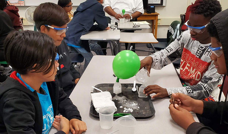 Students participate in a STEM workshop group activity