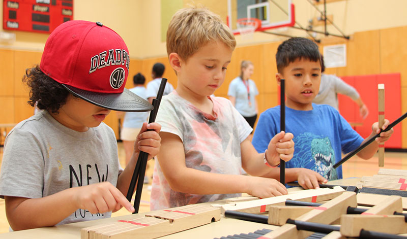 Students participate in a Science Festival activity at their school