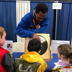 Lawrence On-The-Go Educator showing children Benham's Disk
