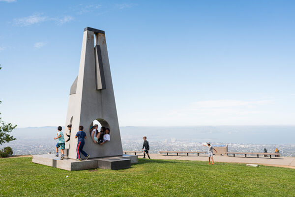 Kids playing on the Sunstones sculpture at The Lawrence