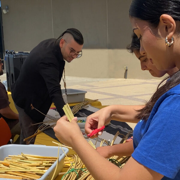 Ohlone Leaders, Vincent and Louis, and staff making tule boats.