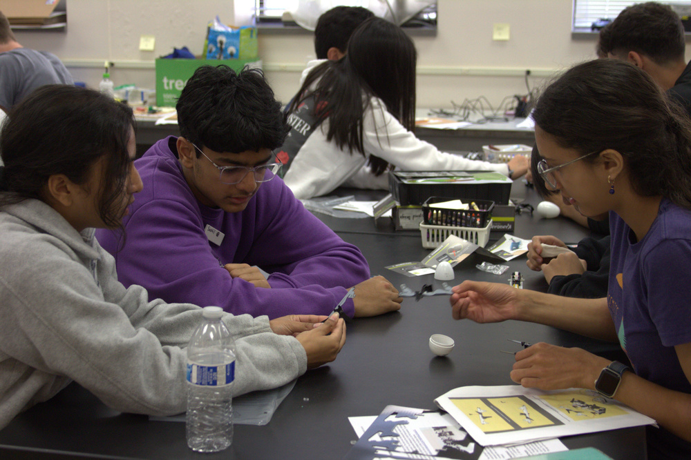 Students working on a small robot.