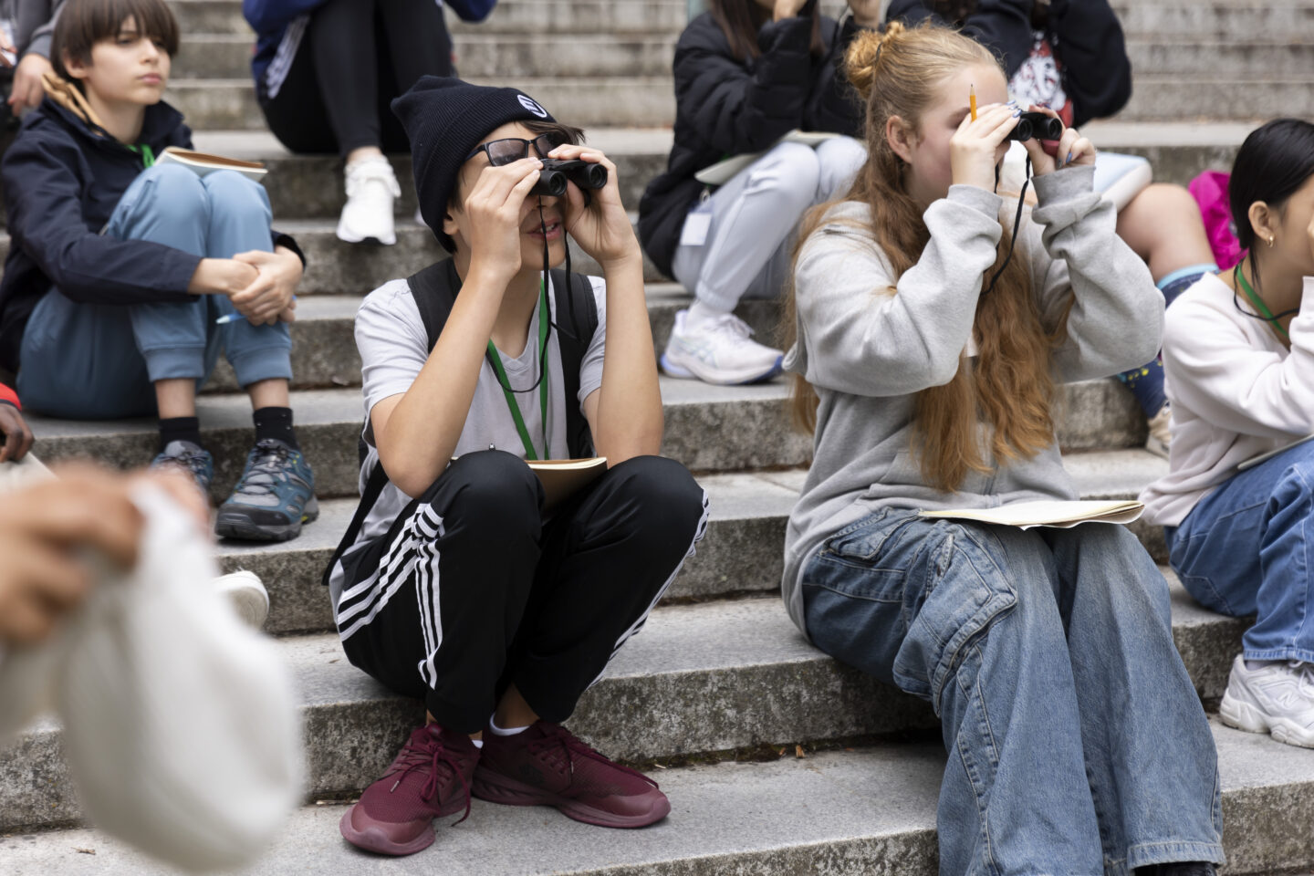 Teens with binoculars