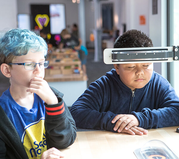 Two young visitors interact with the Mindball exhibit