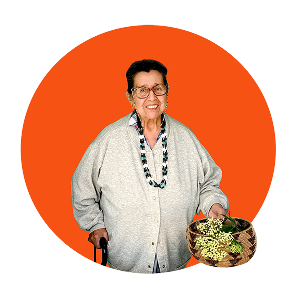 Community Science Hero Dolores Lameira, holding an Ohlone woven basket