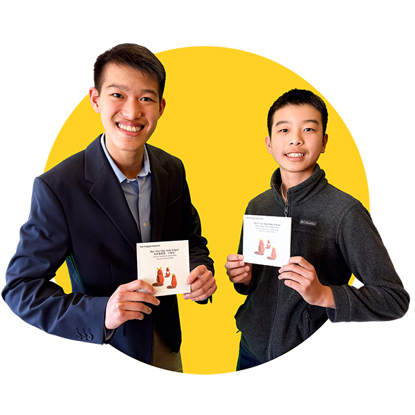 Community Science Heroes Jonathan & William Zhang, holding children's books they authored