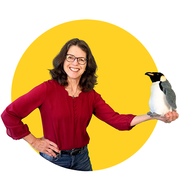 Community Science Hero Teresa Barnett, holding a stuffed penguin toy