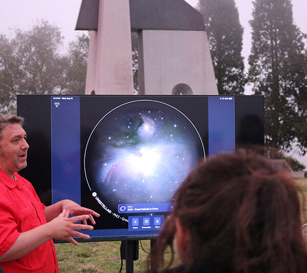 Astronomer Dr. Bryan Mendez takes questions from visitors at a Star Party event at The Lawrence