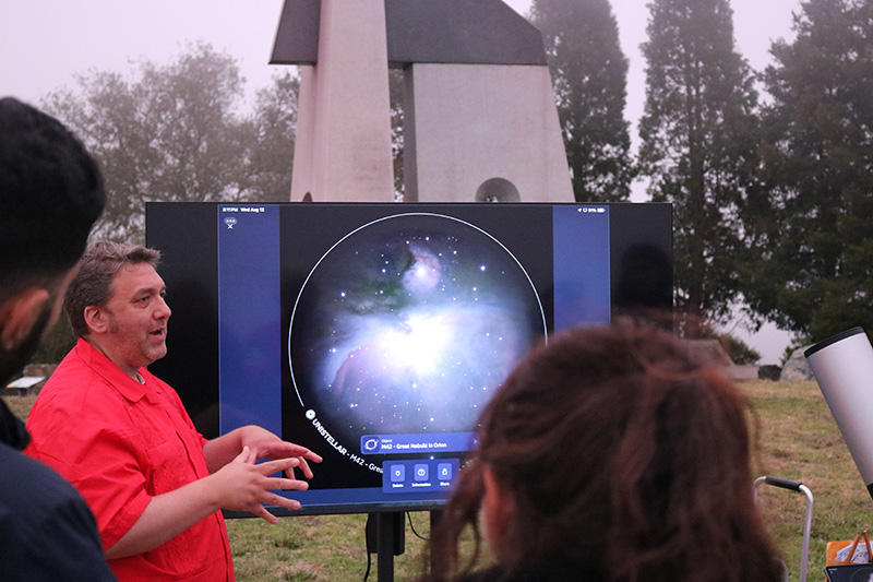 Astronomer Dr. Bryan Mendez takes questions from visitors at a Star Party event at The Lawrence