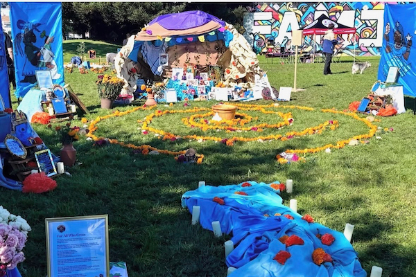 Image Info IMG_2316.jpeg No rating 1 Star 2 Stars 3 Stars 4 Stars 5 Stars Empty Price No profiles set yet. Go to Pricing Profiles to set your prices. Description Screenshot Alt Text A vibrant outdoor memorial features a spiral of marigolds, blue fabric adorned with flowers, candles, and framed messages honoring those who have passed.